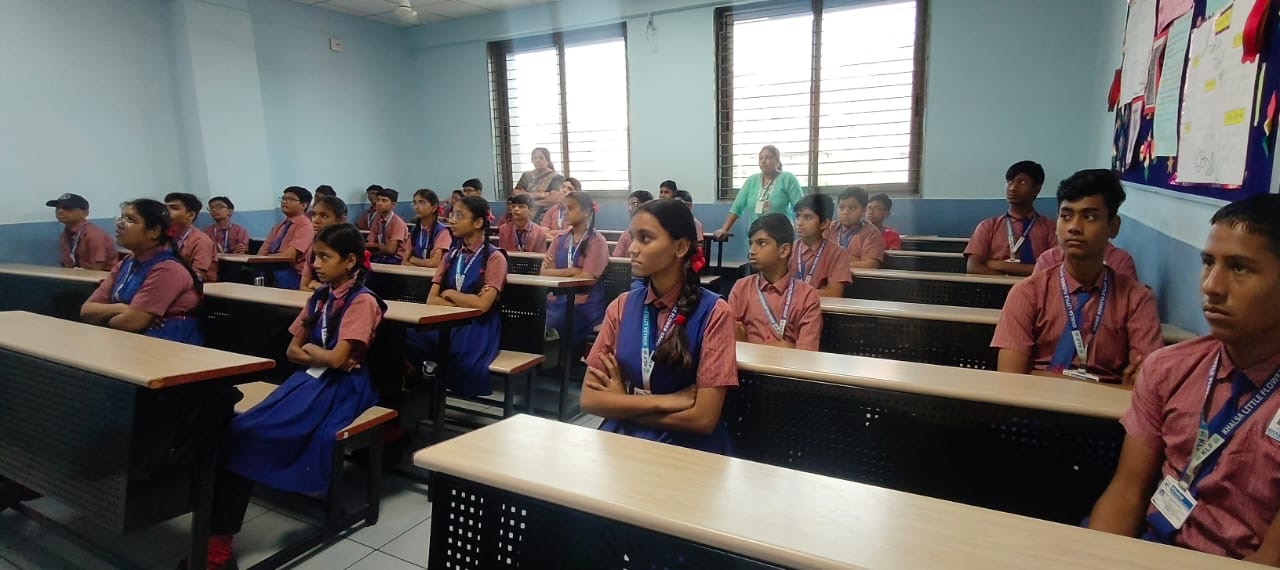 Students and tutors working together around a table